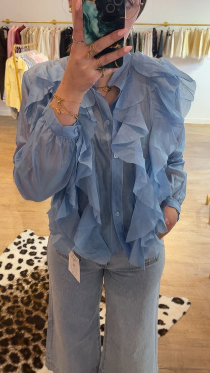 Chemisier bleu à volants