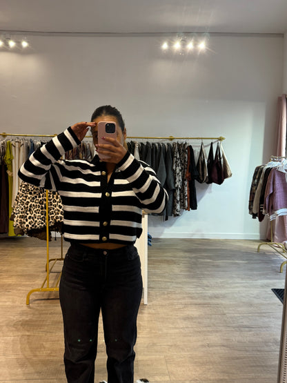 Gilet noir et blanc à rayures et boutons dorés